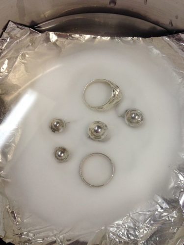 Silver Jewellery soaked in a mix of water and backing soda